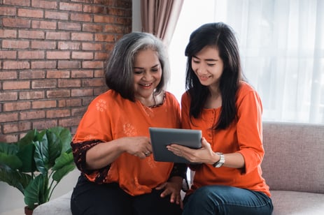 Two women looking at a tablet