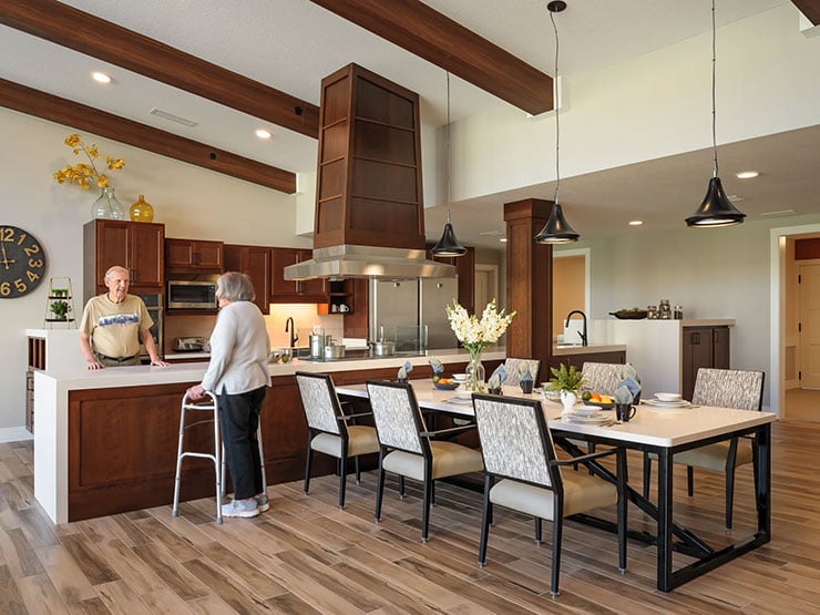 senior friends hanging out in the kitchen