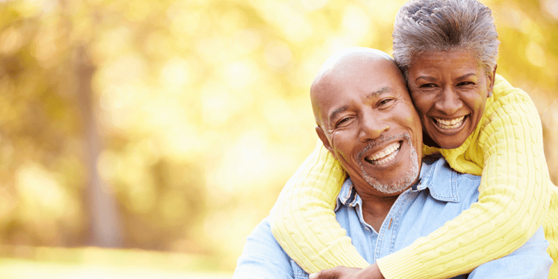 Senior couple relaxing in autumn landscape